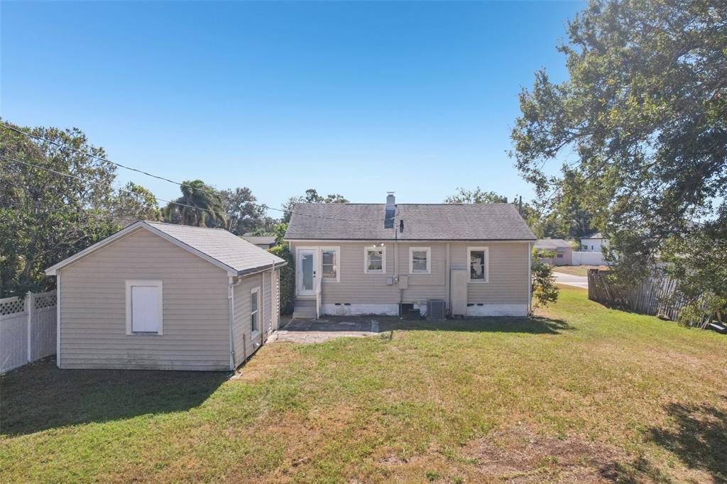 4809 33rd Avenue North St. Petersburg, FL 33713 - Photo 41 of 62 a front view of a house with a yard and garage