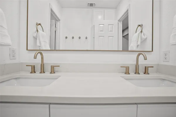 a bathroom with kitchen sink