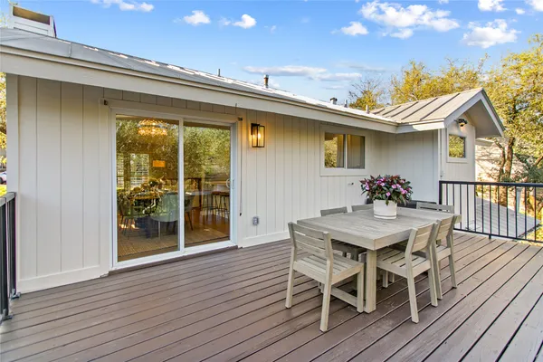 a view of a house with furniture and wooden floor