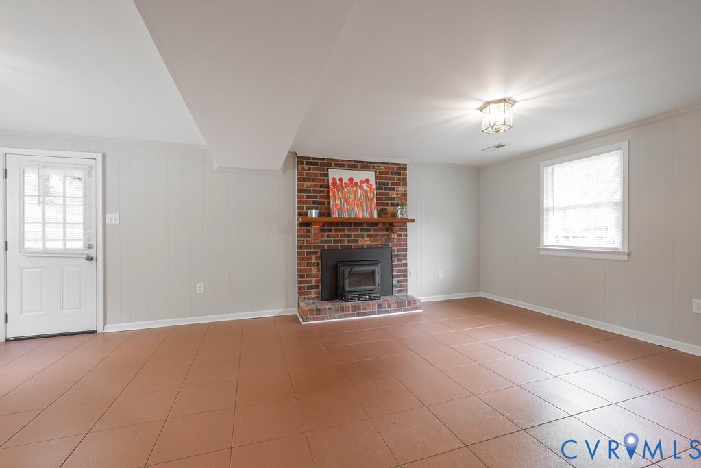6901 Manning Road Chesterfield, VA 23832 - Photo 42 of 57 Brick fireplace with a wood mantle, wood-finish fl