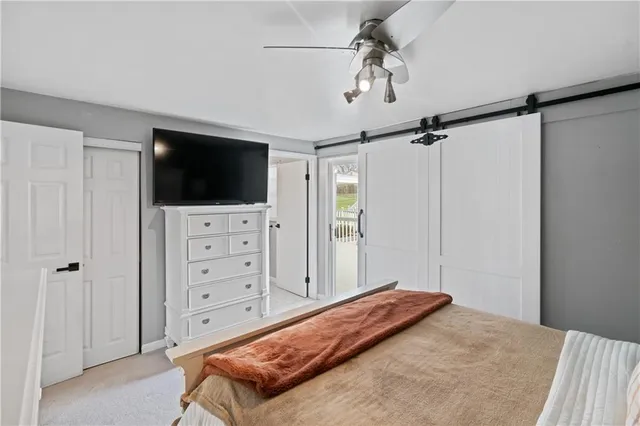 a bed room with a bed and a chandelier