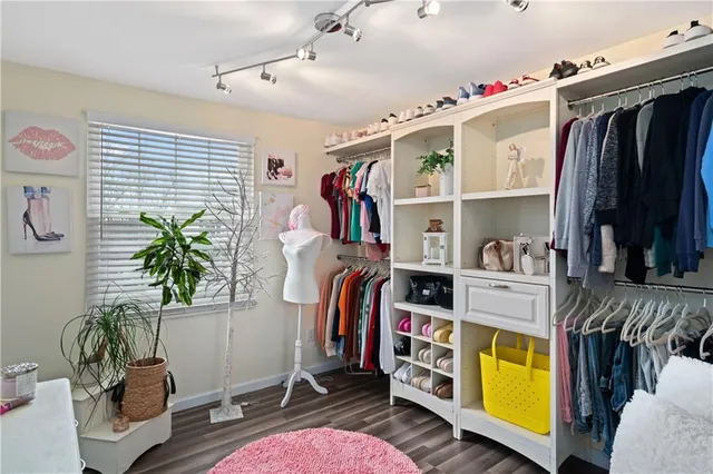 a living room with furniture and book shelf