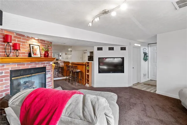 a view of a dining room and livingroom with furniture