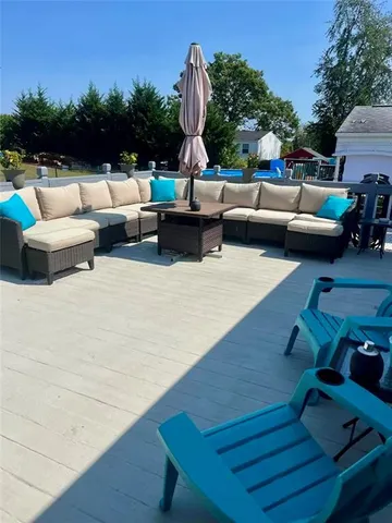 a view of a patio with couches and a fire pit