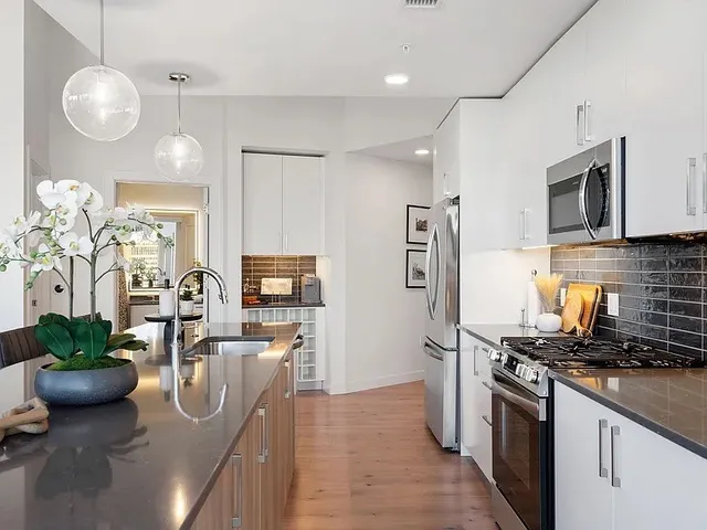 a bedroom with a large bed and a large window