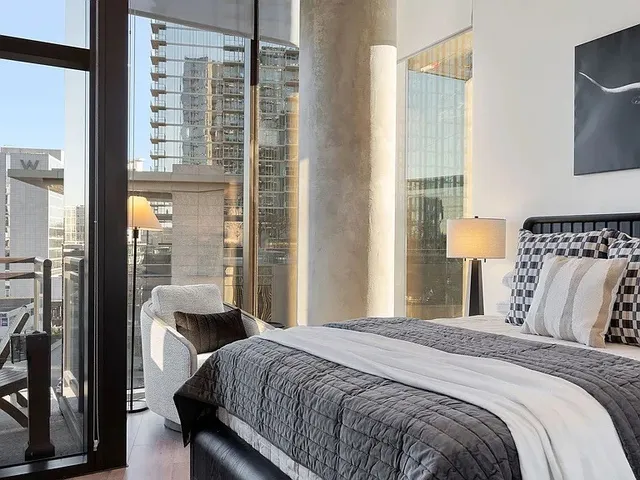 a kitchen with kitchen island granite countertop lots of counter top space and stainless steel appliances