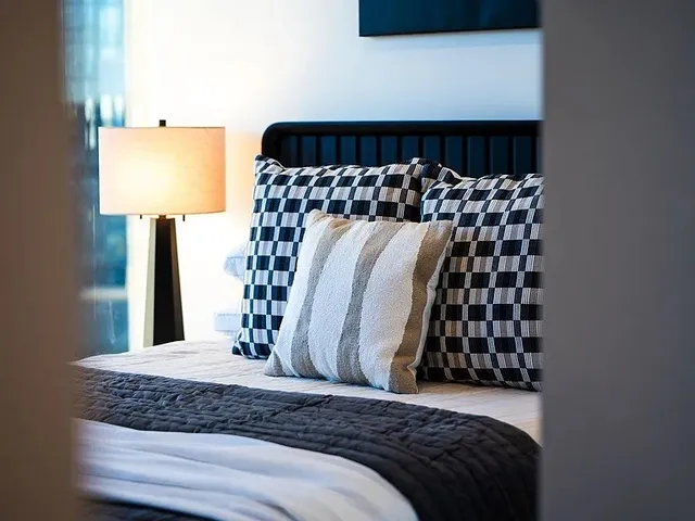 a living room with furniture wooden floor and a large window