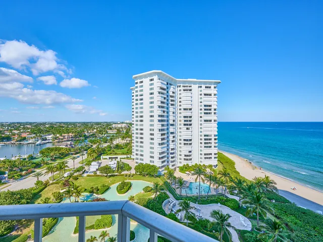 a view of a garden with a building in the background