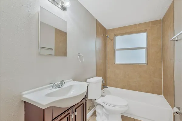 a bathroom with a sink toilet and mirror