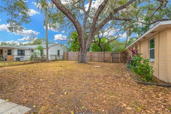 a backyard of a house with lots of green space