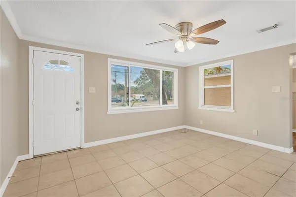 a view of an empty room with a window