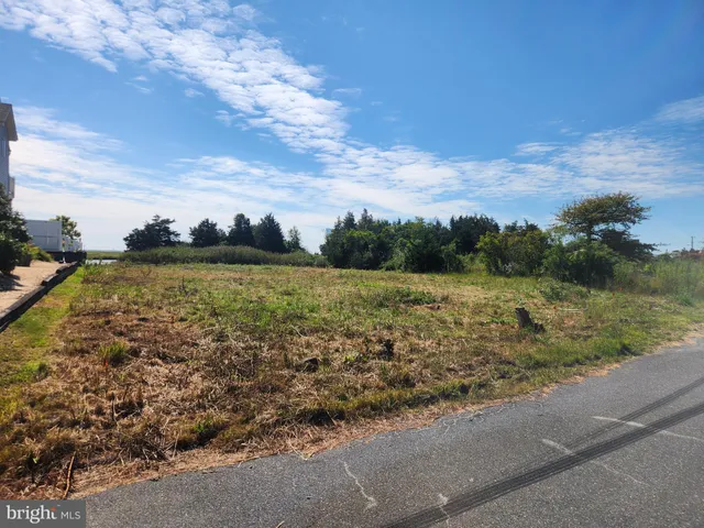 a view of a lake with a big yard
