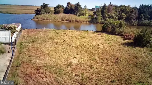 a bed room with a bed and a chair