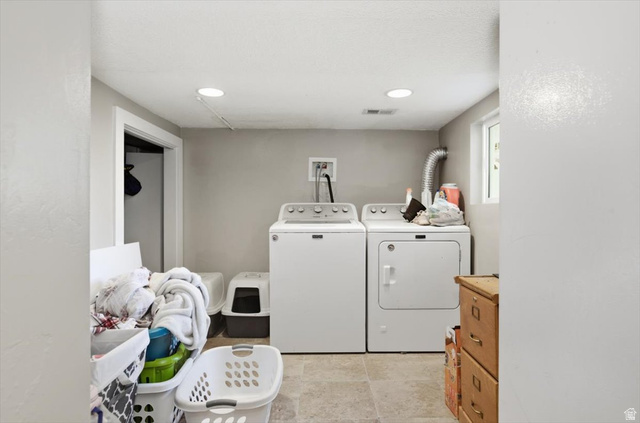 565 East 800 North Logan, UT 84321 - Photo 17 of 27 Utility area featuring a washer and dryer, recessed lighting, a window, and tiled flooring