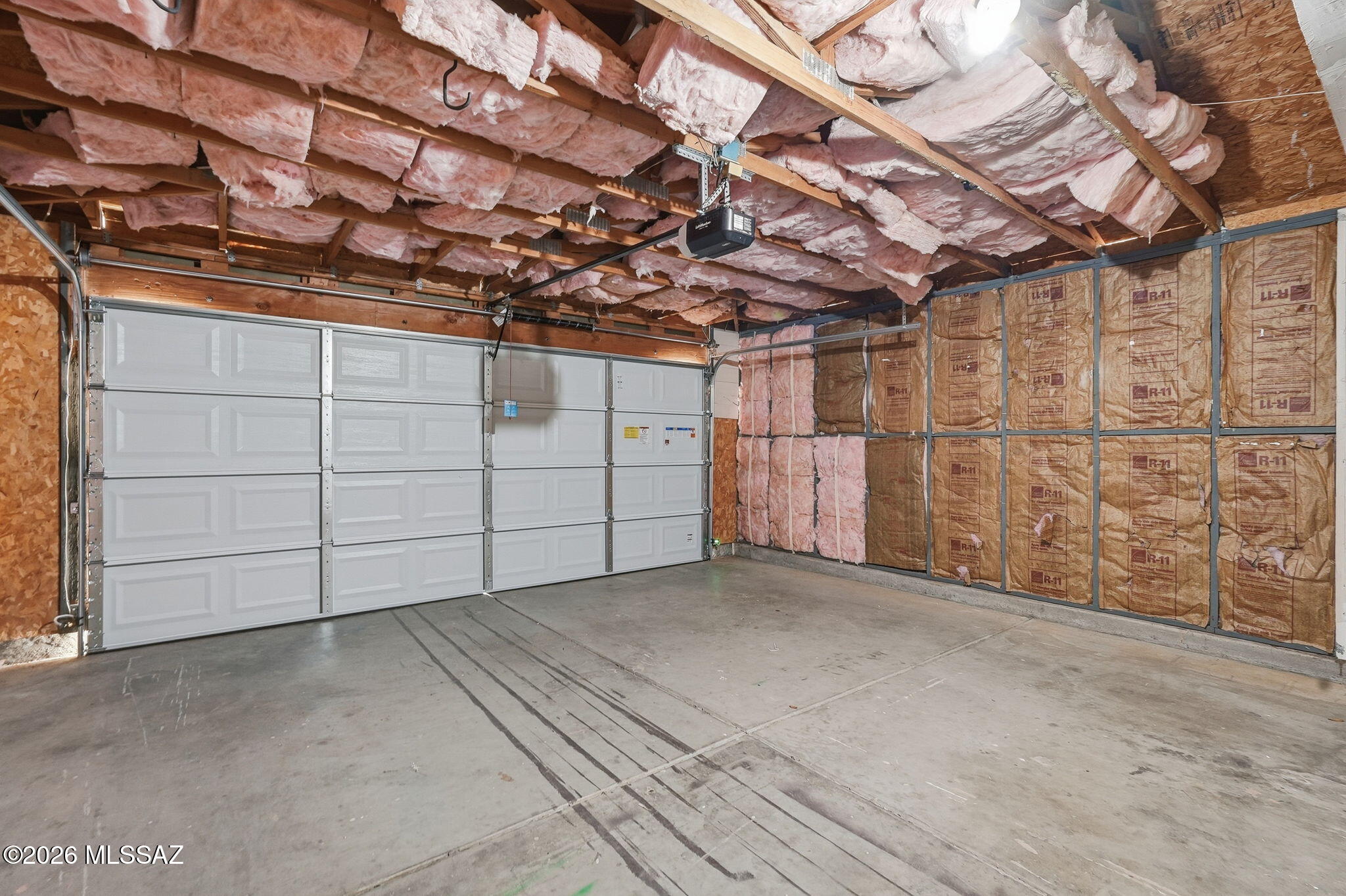 5791 North Moonbrook Road Tucson, AZ 85741 - Photo 29 of 40 Insulated Garage with Cabinets - Possible Workshop