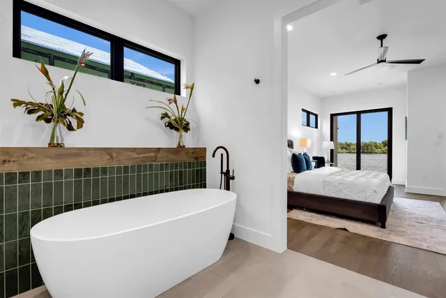 a bathroom with a bathtub and a shower