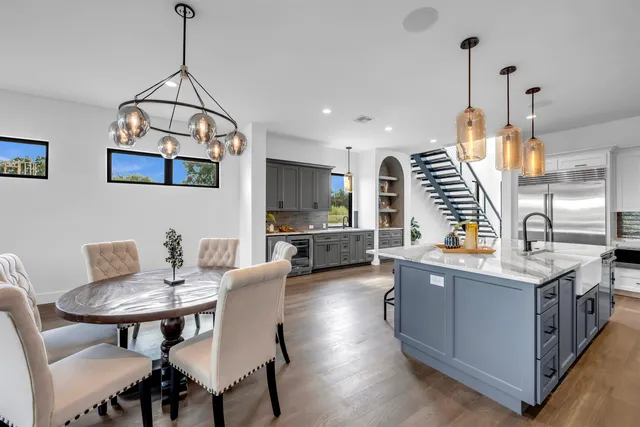 a view of kitchen with sink and wooden floor
