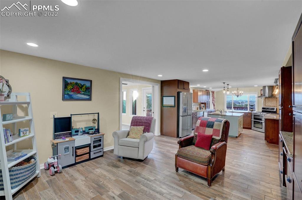 1451 R Street Penrose, CO 81240 - Photo 16 of 50 a living room with furniture and a flat screen tv
