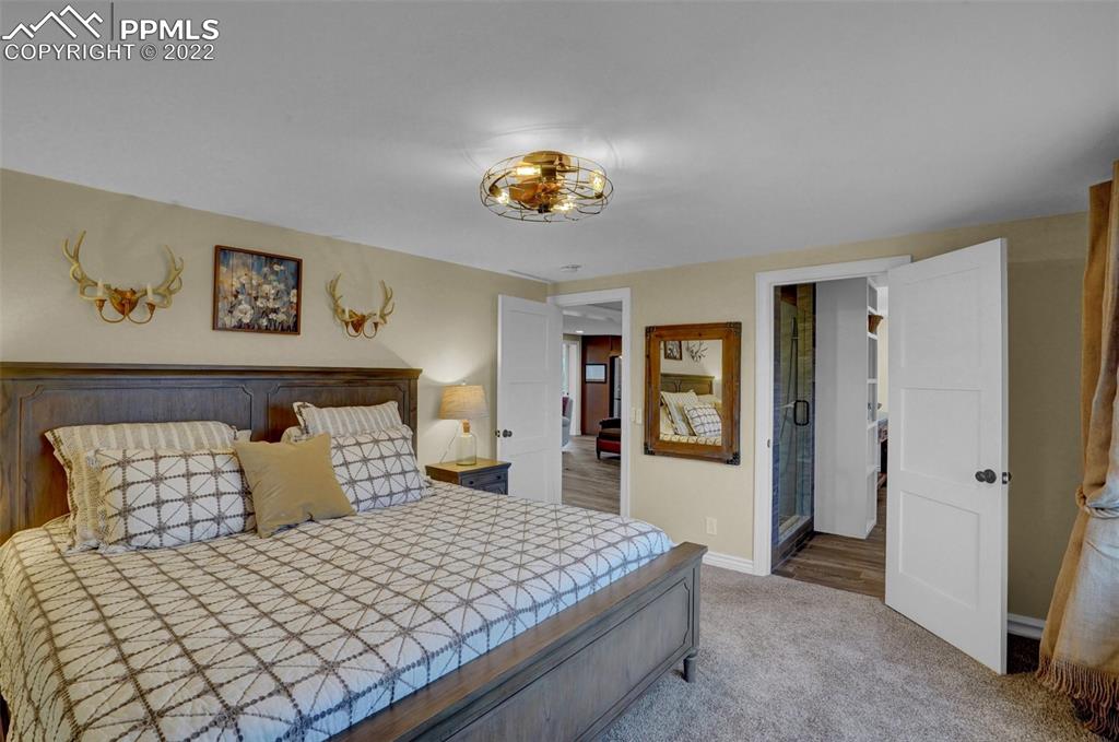 1451 R Street Penrose, CO 81240 - Photo 18 of 50 a bedroom with a bed and window