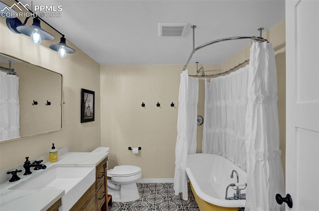 1451 R Street Penrose, CO 81240 - Photo 23 of 50 a bathroom with a sink toilet and shower