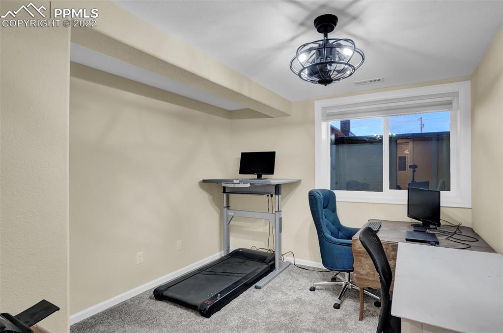 1451 R Street Penrose, CO 81240 - Photo 32 of 50 a workspace with a couch