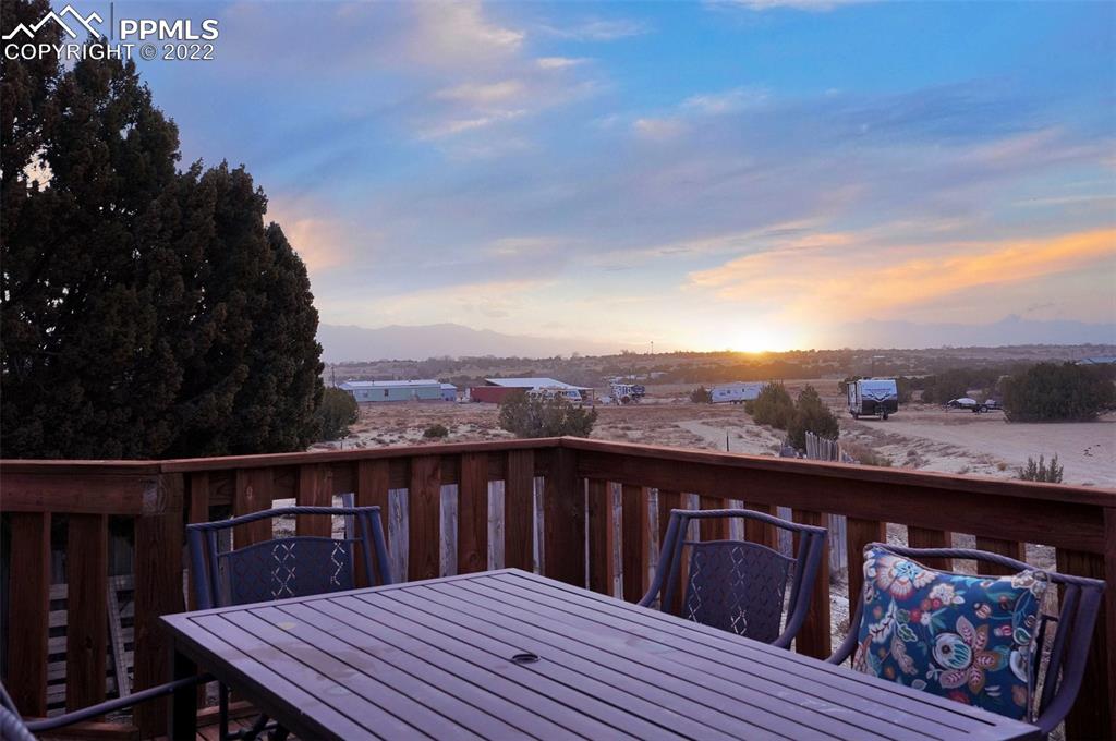 1451 R Street Penrose, CO 81240 - Photo 39 of 50 a view of a balcony with wooden floor and fence