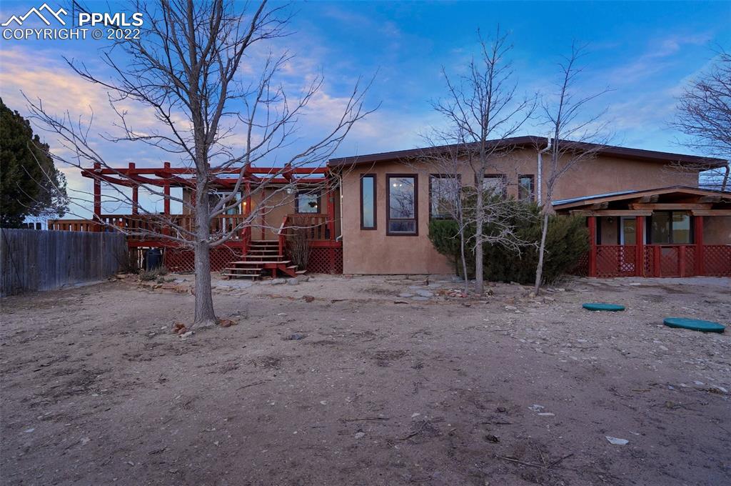 1451 R Street Penrose, CO 81240 - Photo 41 of 50 a view of a house with a yard and wooden fence