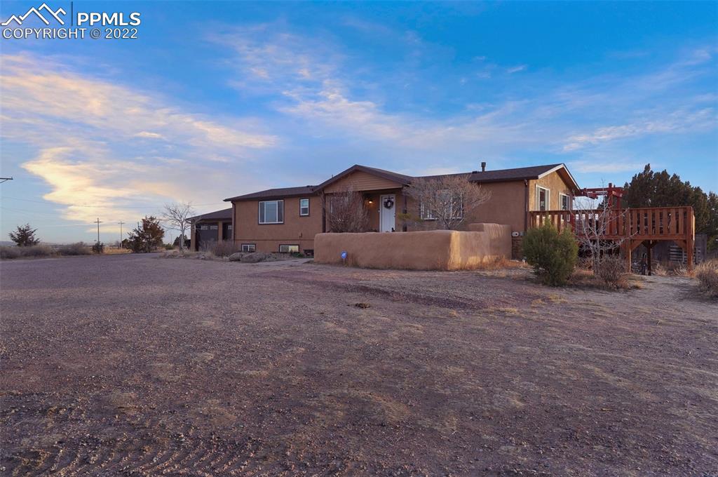 1451 R Street Penrose, CO 81240 - Photo 49 of 50 a view of large house with a big yard and large tree