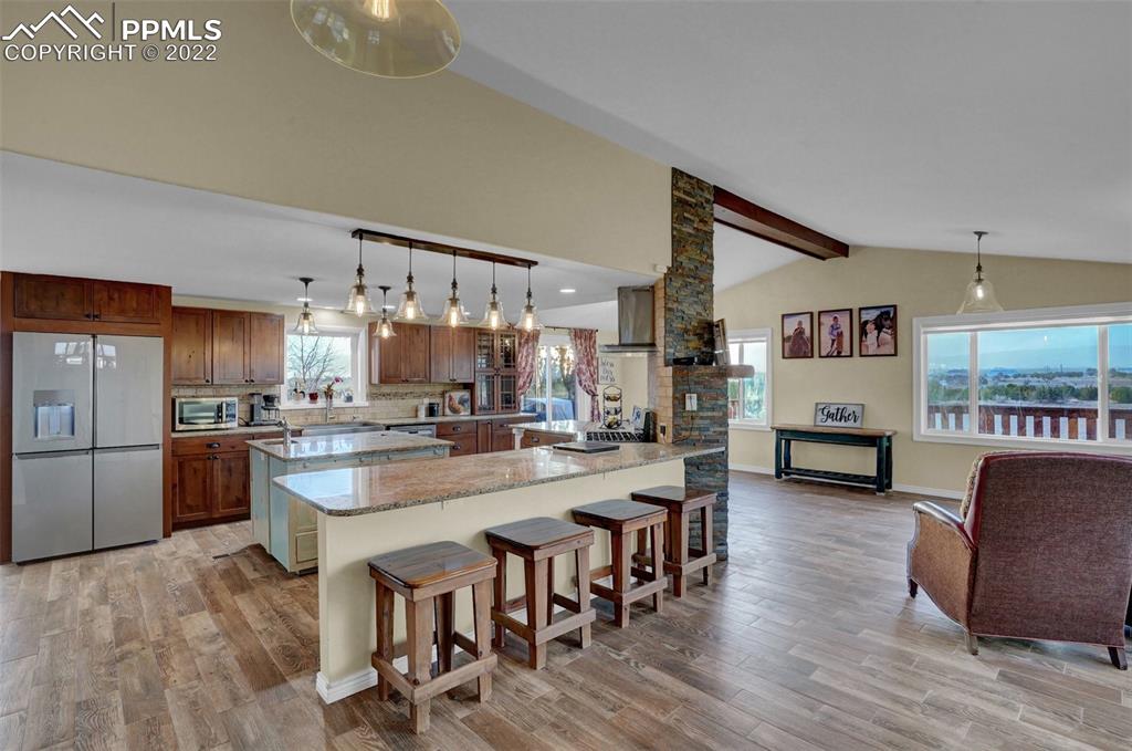 1451 R Street Penrose, CO 81240 - Photo 6 of 50 a large kitchen with a table and chairs in it