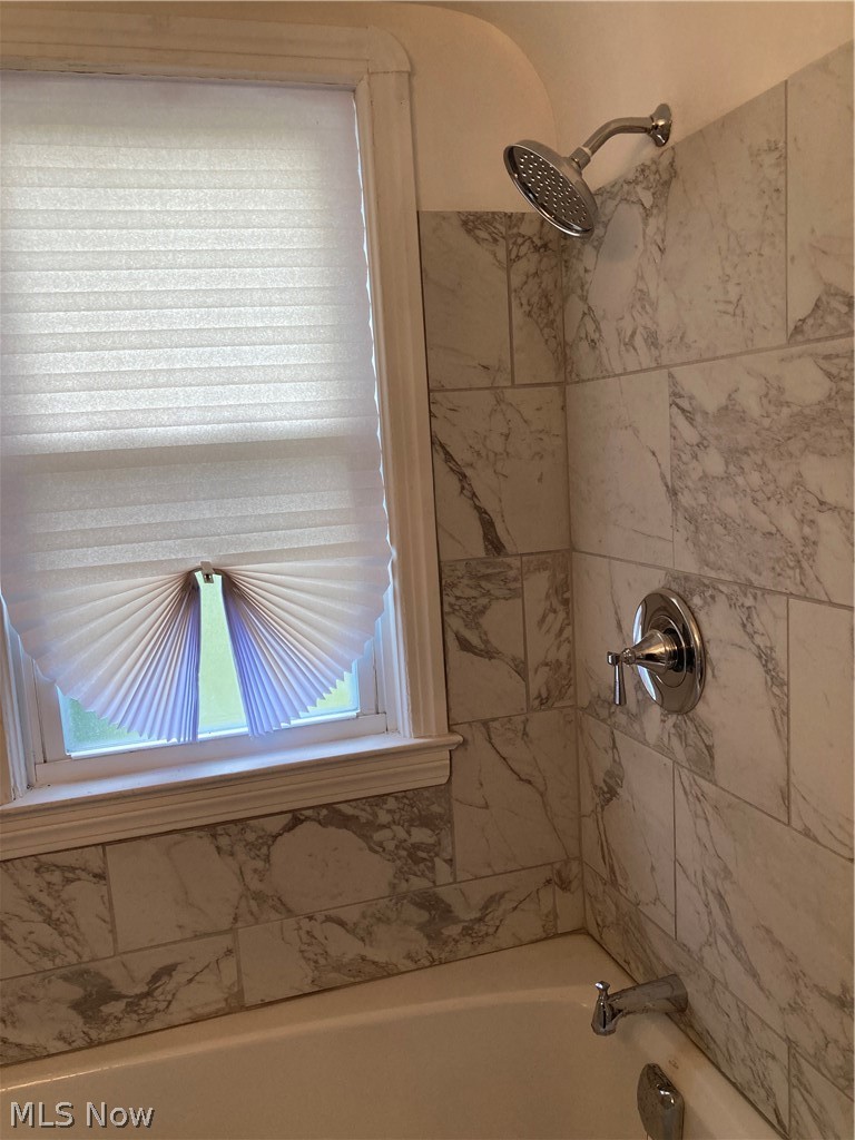 3800 Strandhill Road Cleveland, OH 44128 - Photo 8 of 34 Bathroom featuring tiled shower / jetted bath combo and plenty of natural light