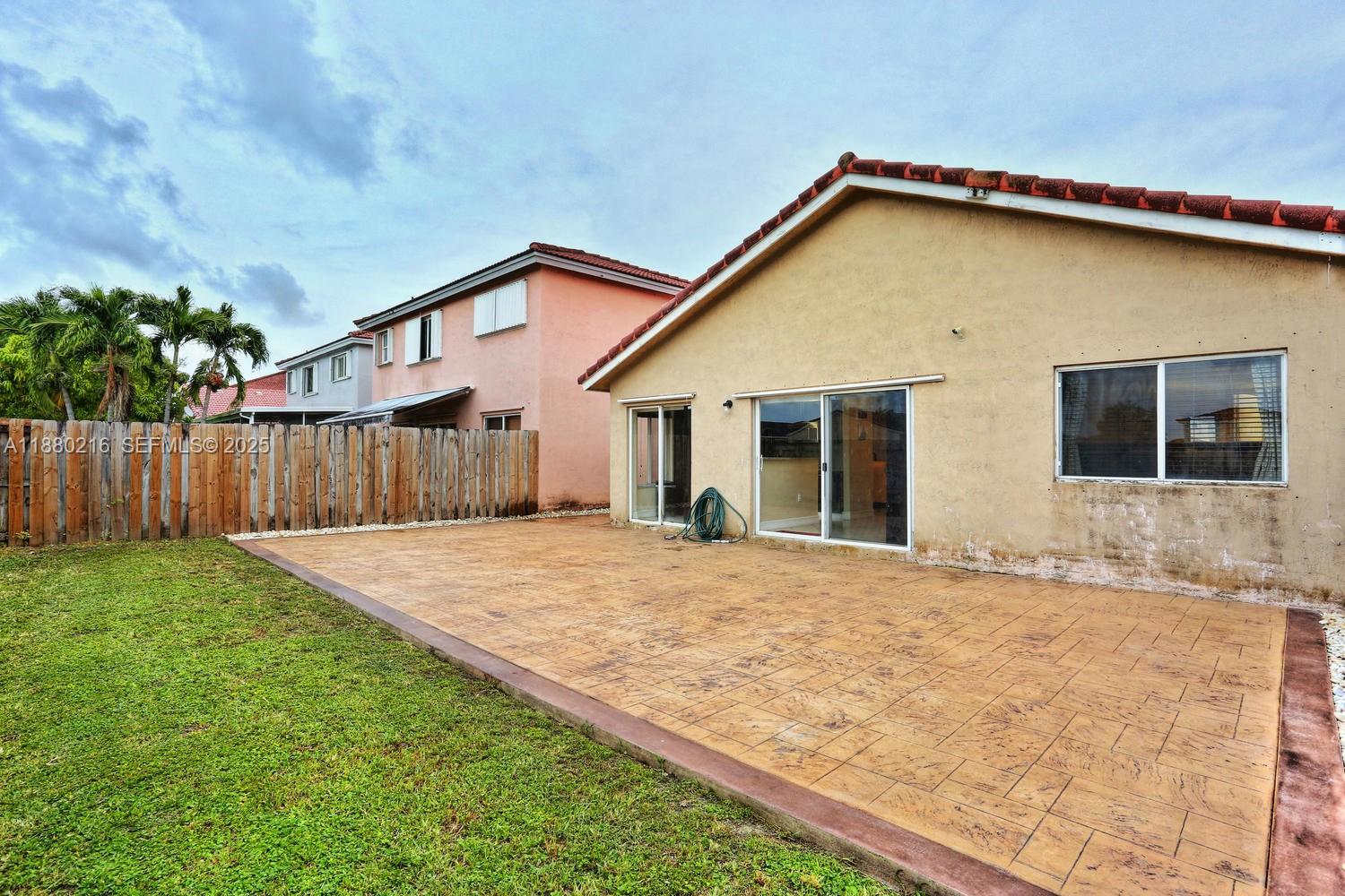 14285 Southwest 176th Terrace Miami, FL 33177 - Photo 20 of 20 a view of a house with wooden fence