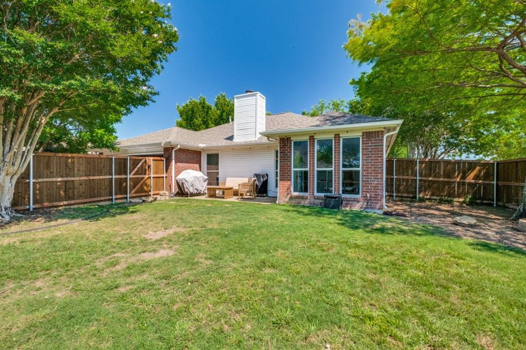 11709 Harbor Road Frisco, TX 75035 - Photo 12 of 12 a view of a house with backyard and porch
