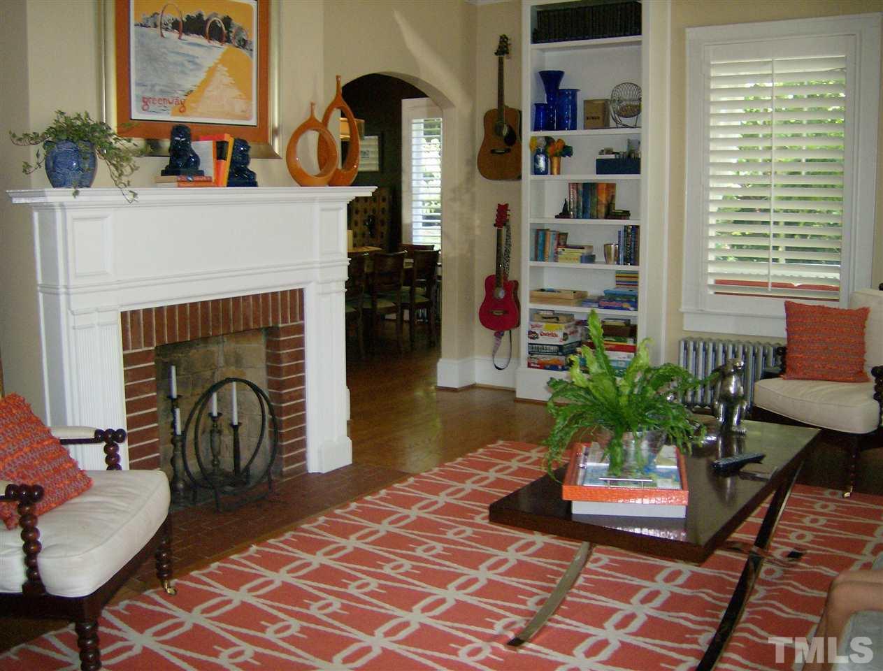 919 West Johnson Street Raleigh, NC 27605 - Photo 2 of 20 a living room with furniture and a fireplace