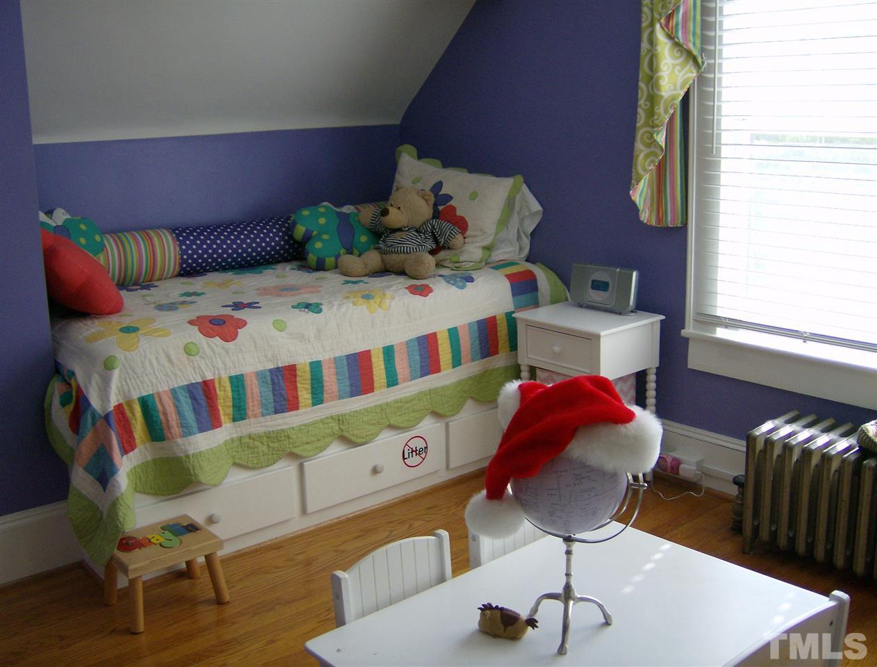 919 West Johnson Street Raleigh, NC 27605 - Photo 12 of 20 a bedroom with furniture and a chair