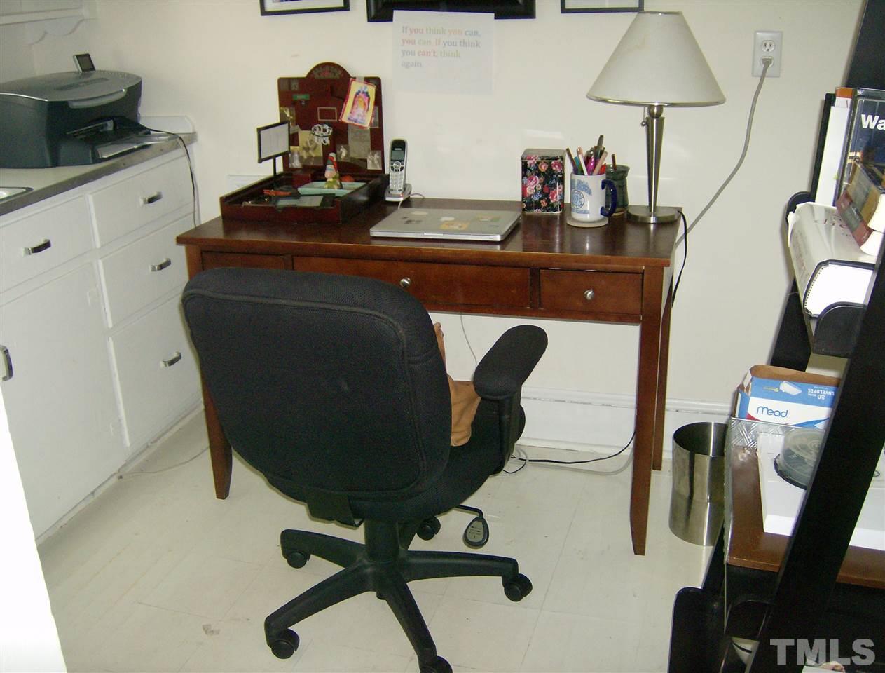 919 West Johnson Street Raleigh, NC 27605 - Photo 14 of 20 a room with furniture and a mirror