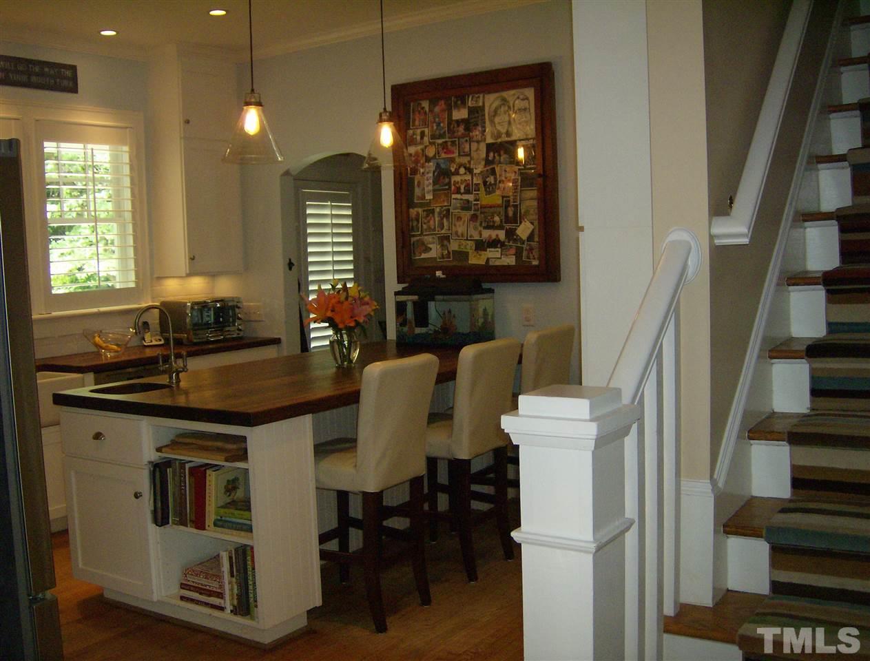 919 West Johnson Street Raleigh, NC 27605 - Photo 15 of 20 a kitchen with a table chairs and a window