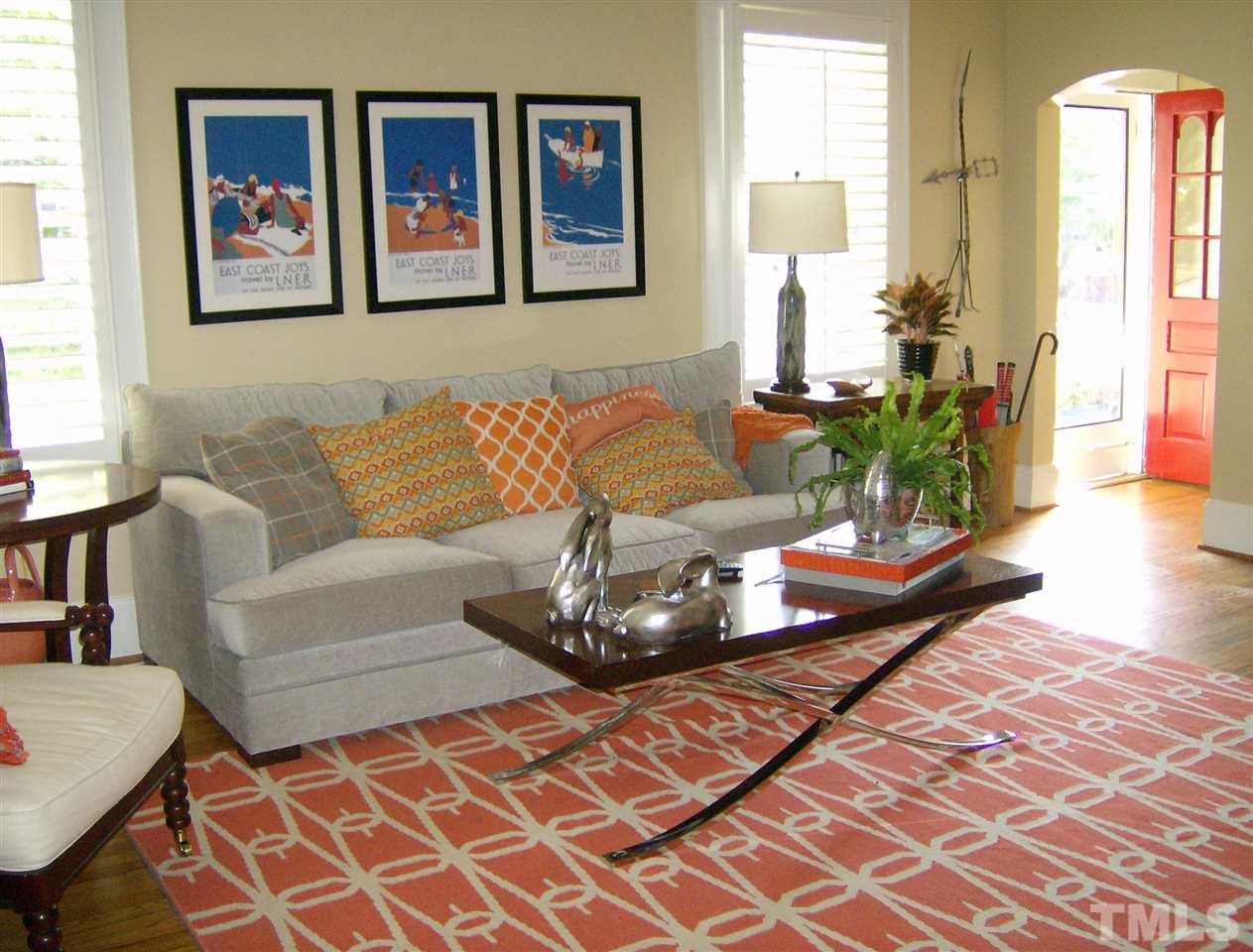 919 West Johnson Street Raleigh, NC 27605 - Photo 3 of 20 a living room with furniture and a rug