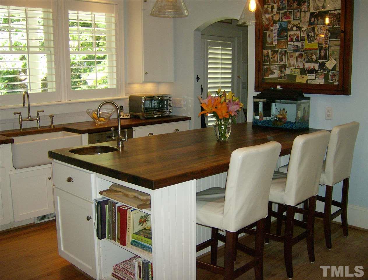 919 West Johnson Street Raleigh, NC 27605 - Photo 7 of 20 a kitchen with a table chairs and window