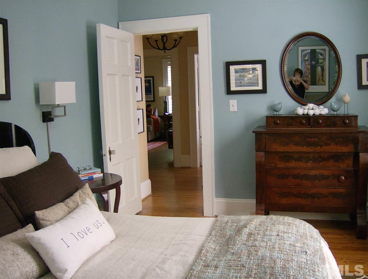 919 West Johnson Street Raleigh, NC 27605 - Photo 8 of 20 a bedroom with a bed and a dresser