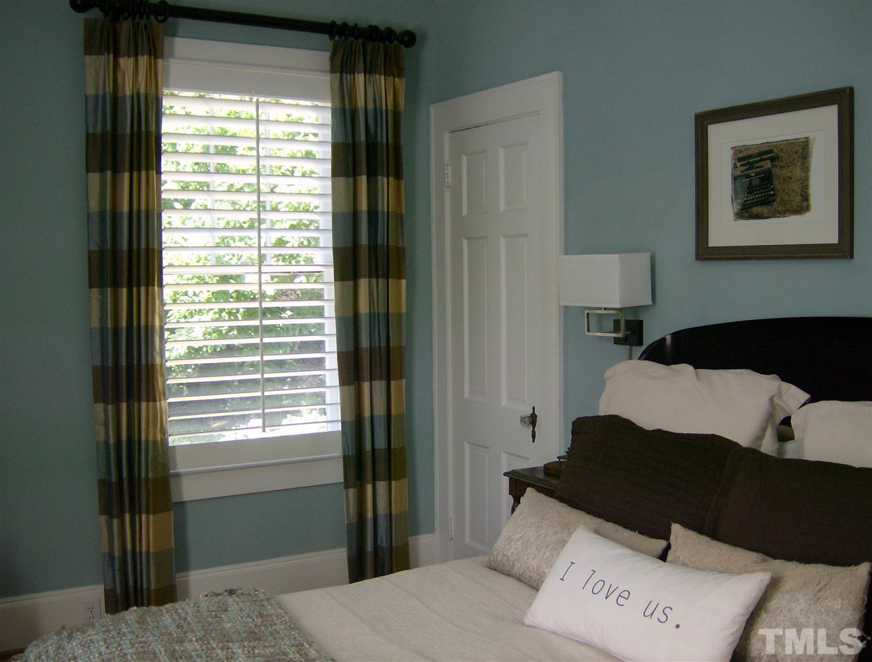 919 West Johnson Street Raleigh, NC 27605 - Photo 9 of 20 a bedroom with a bed and a window