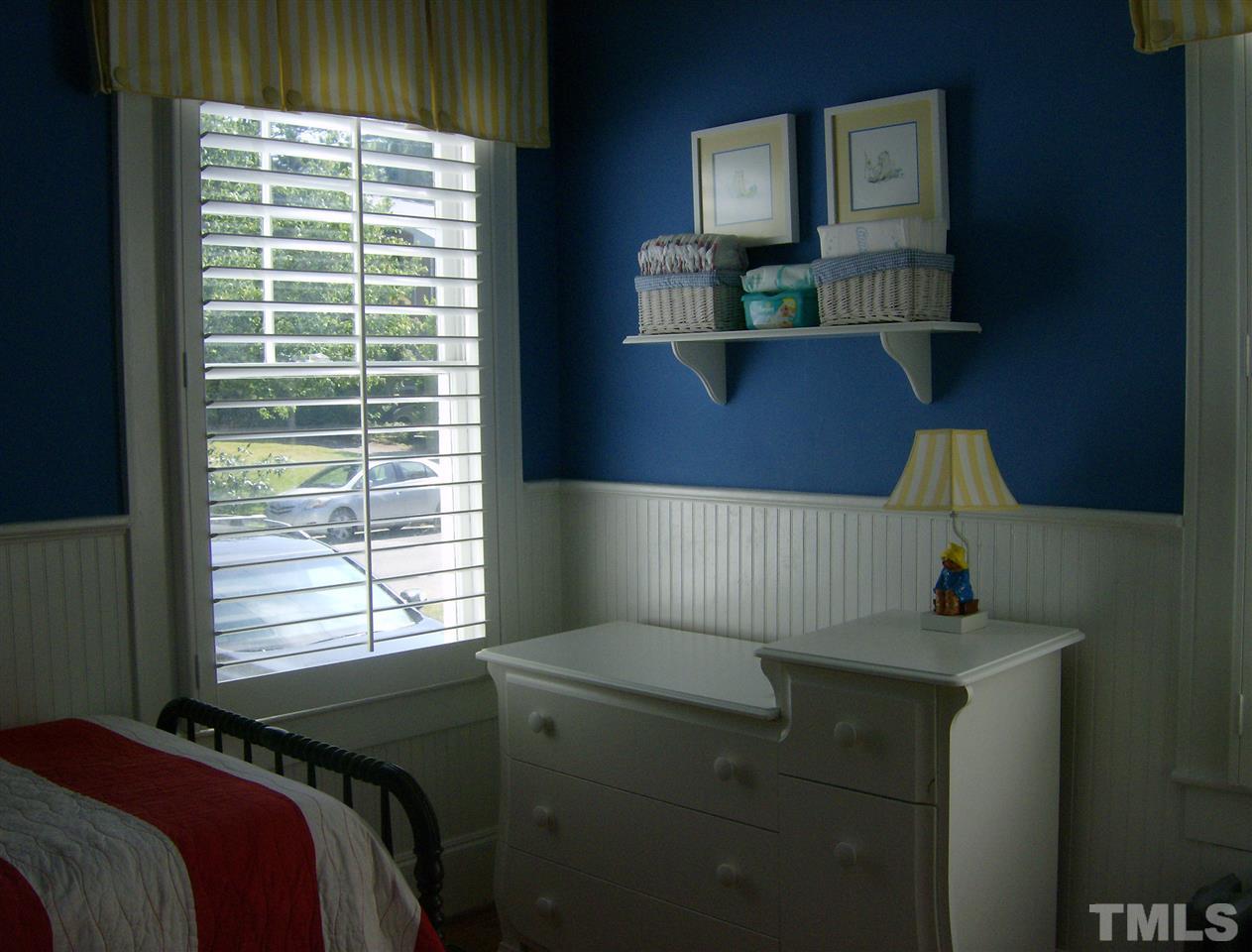 919 West Johnson Street Raleigh, NC 27605 - Photo 10 of 20 a bedroom with a bed and a window