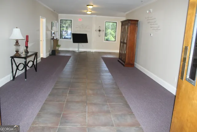 a bathroom with a sink a vanity and window