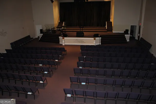 a brick building with a door and a shower