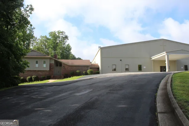 a view of a house with a yard and garage