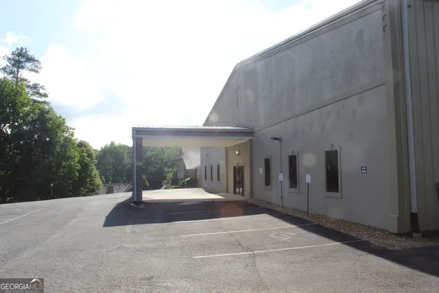 a bathroom with a shower and a sink