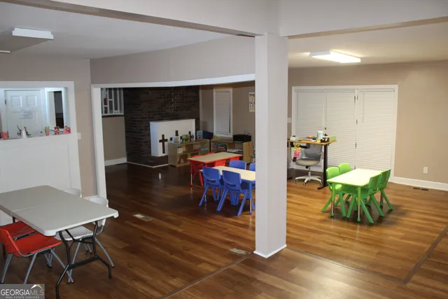 a view of a dining room with furniture wooden floor and chandelier