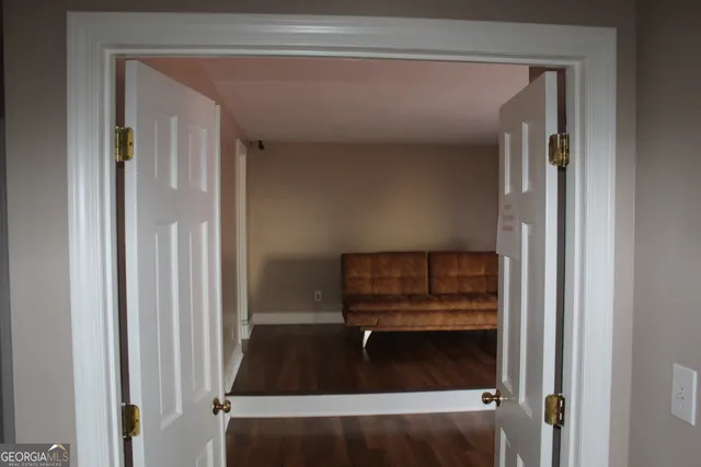 a bathroom with a black and white checkered floor