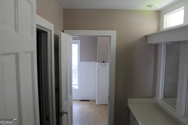 a bathroom with a shower and toilet