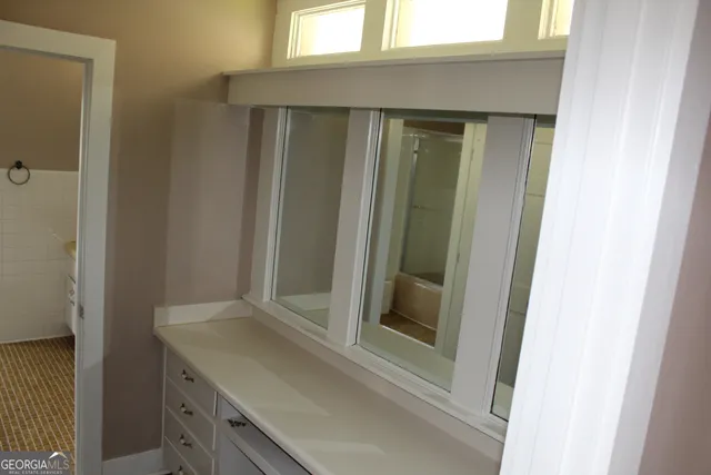 a view of an empty room and window