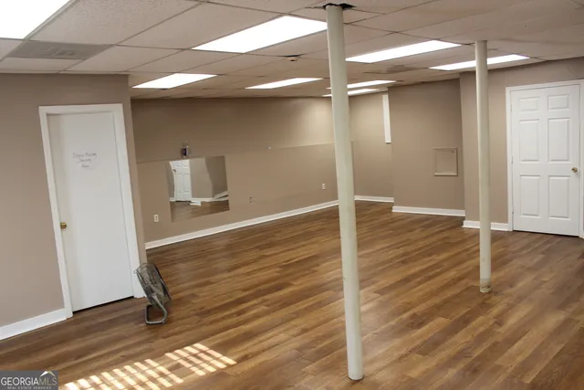 a bathroom with a sink a toilet a mirror and vanity